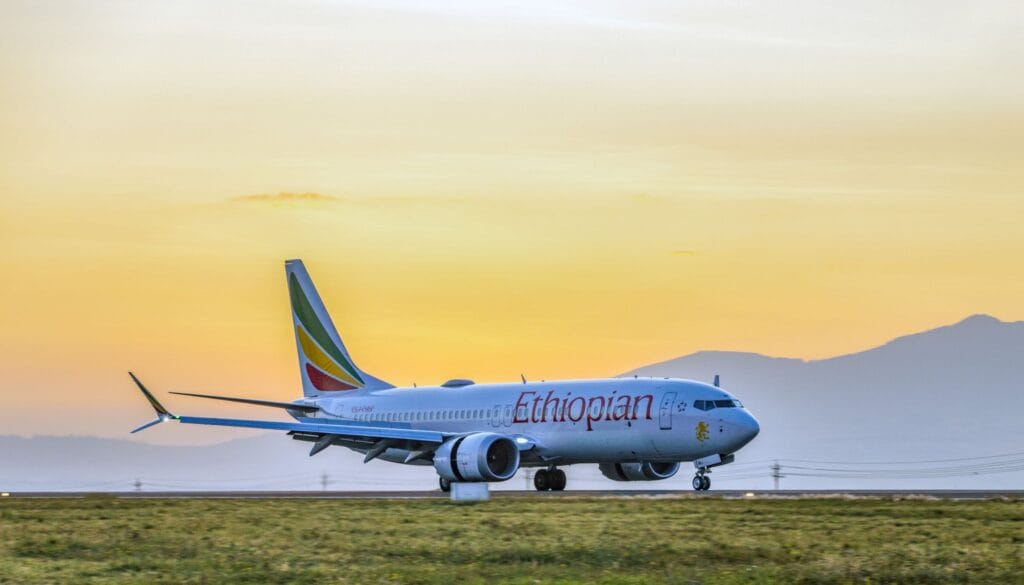 Ethiopian Airlines passenger aircraft on a runway at sunset
