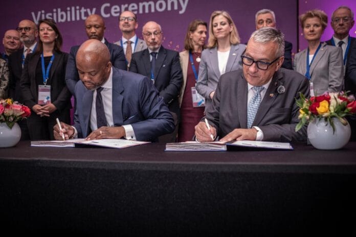 Wamkele Mene, AfCFTA Secretary-General, on the left, and Jozef Síkela, on the right, sign a memorandum of understanding at the Hilton Hotel in Addis Ababa.
