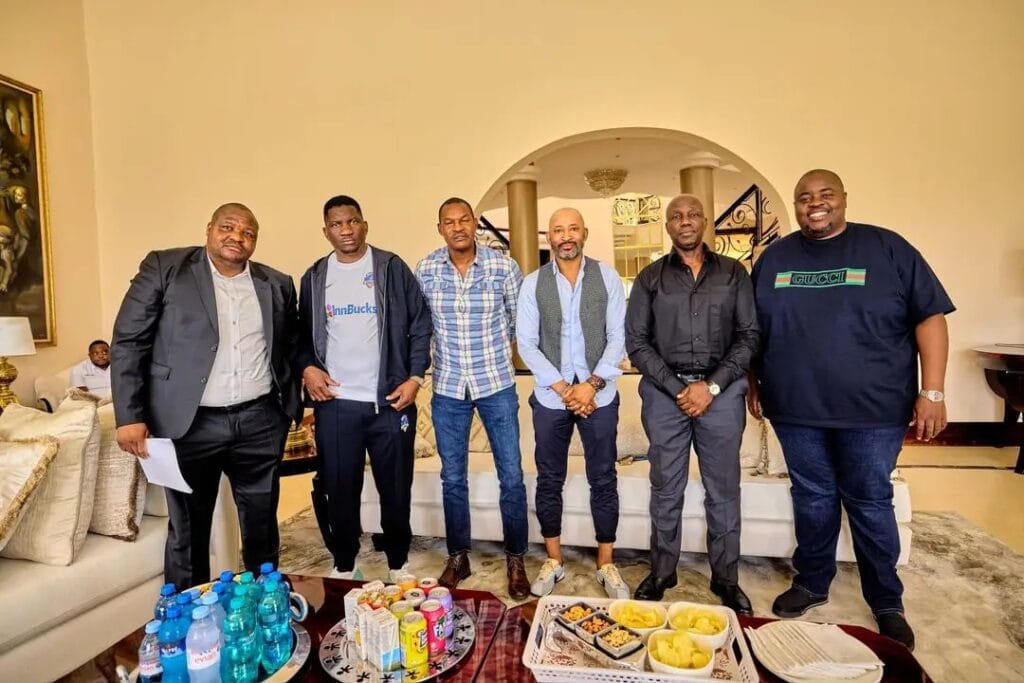 Zimbabwean football icon Peter Ndlovu with the leadership of Scottland FC, including club owner Scott Sakupwanya and club sponsor Wicknell Chivayo.